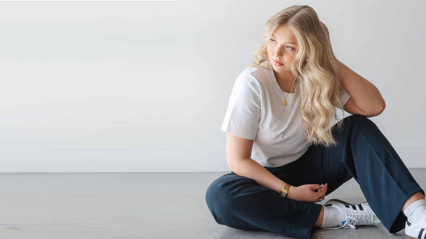 Stylist applying toner and gloss during a fall hair refresh at FORD Salon Kelowna.